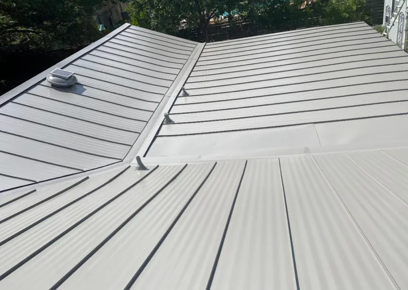 Solar attic fan installed on a metal roof for Roof Ventilation in Oak Harbor